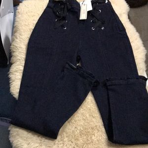 Jeans with lace up front and frill bottom